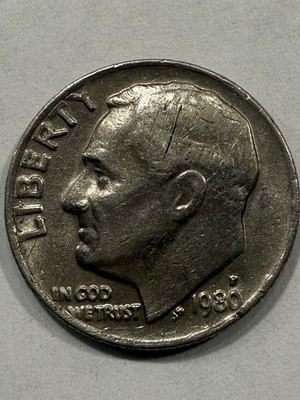 1980 Roosevelt dime missing clad layer error showing exposed copper core on one side