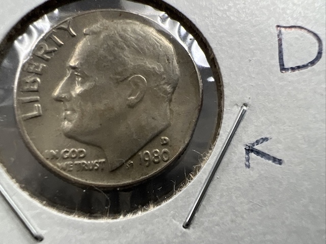 1980 Roosevelt dime clipped planchet error showing curved section missing from the coin rim